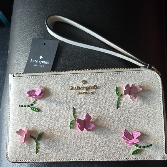 kate spade Handbags - Kate Spade Cream Lucy Wristlet with Pink Floral 3D Accents